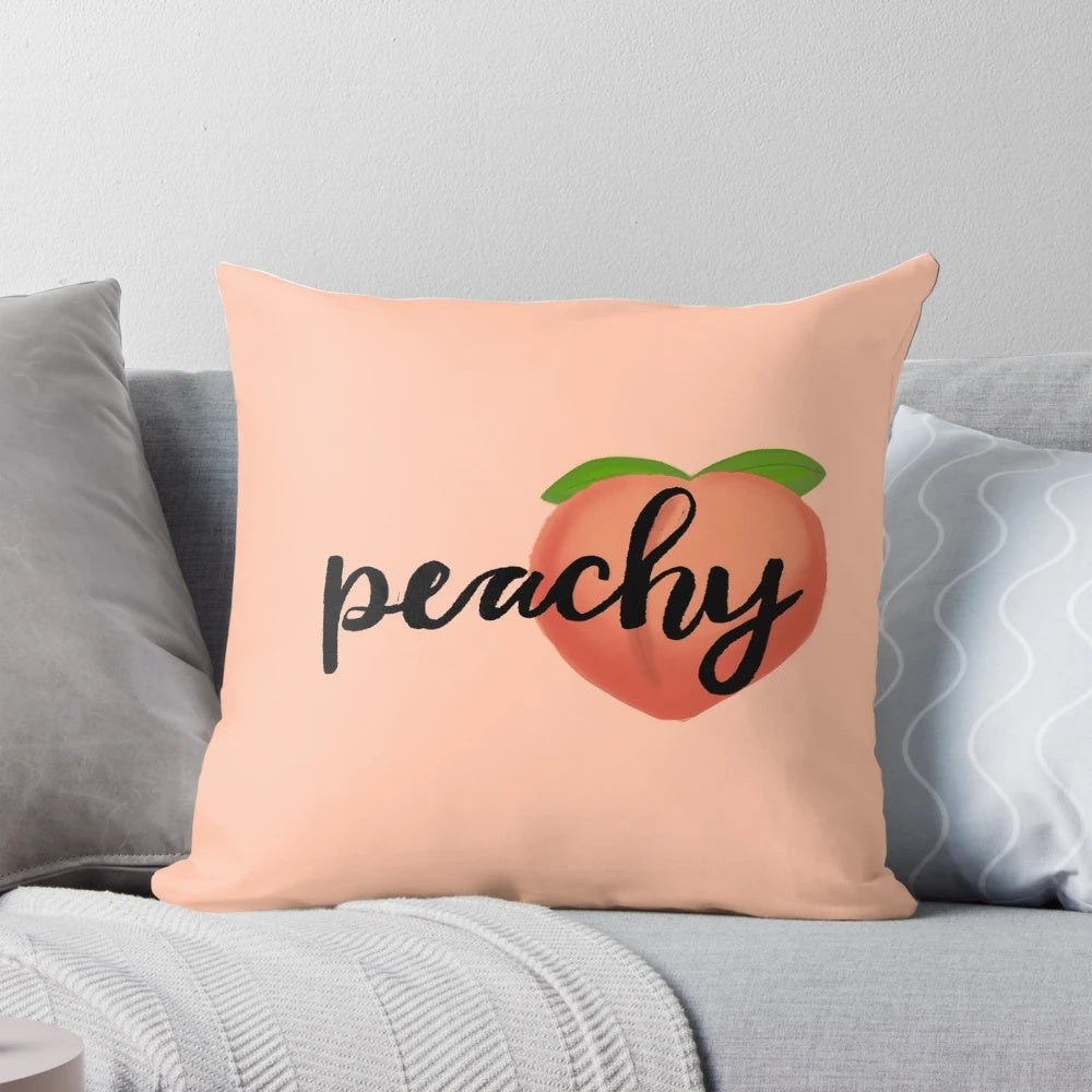 A soft, peach-colored pillow with a cute cartoon emoji design, perfect for adding a pop of color and personality to any room.