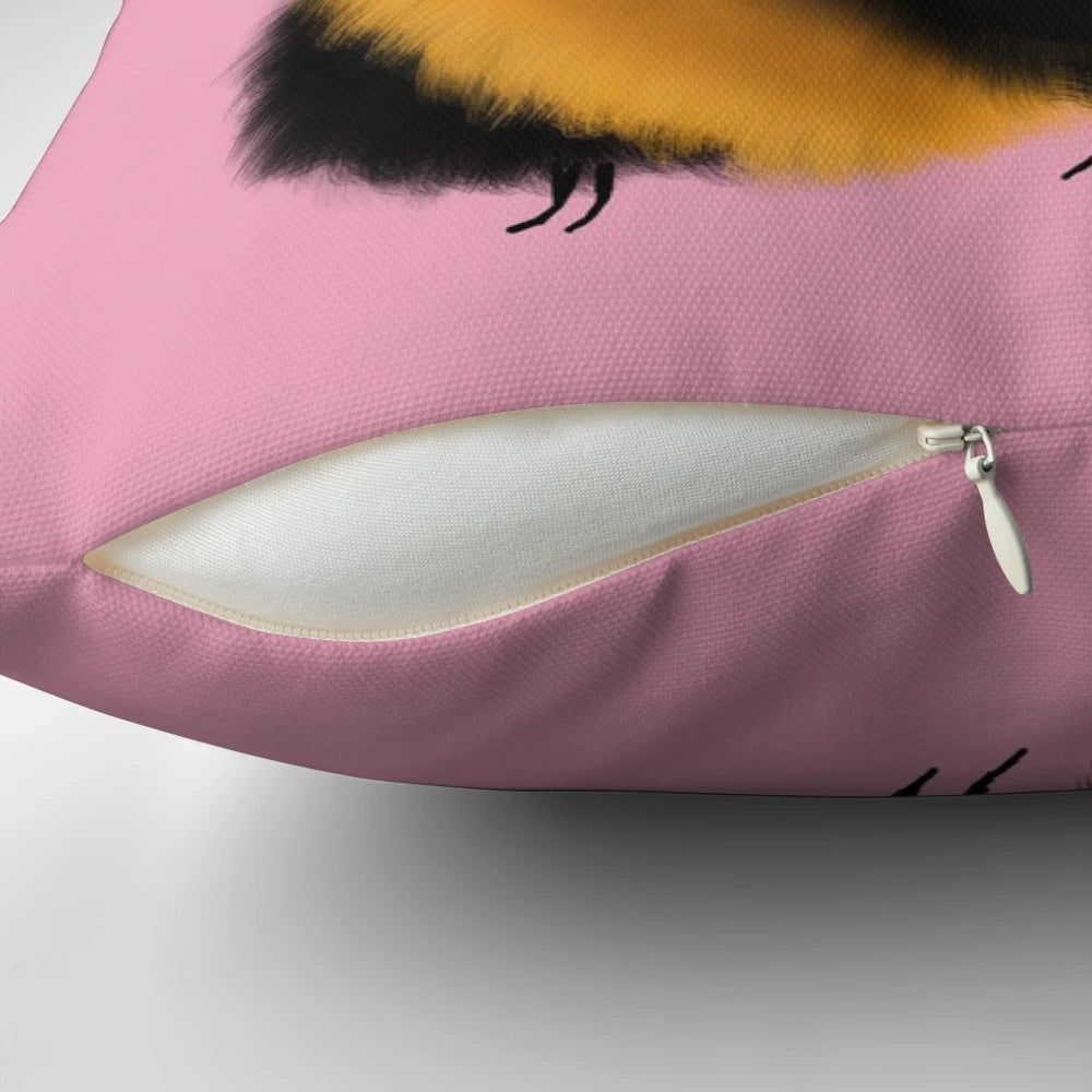 A colorful, fluffy, and cute bee-shaped decorative throw pillow with a pink background.