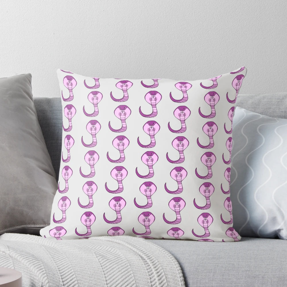 A cute and whimsical pink cobra throw pillow, perfect for adding a touch of playfulness to any room.