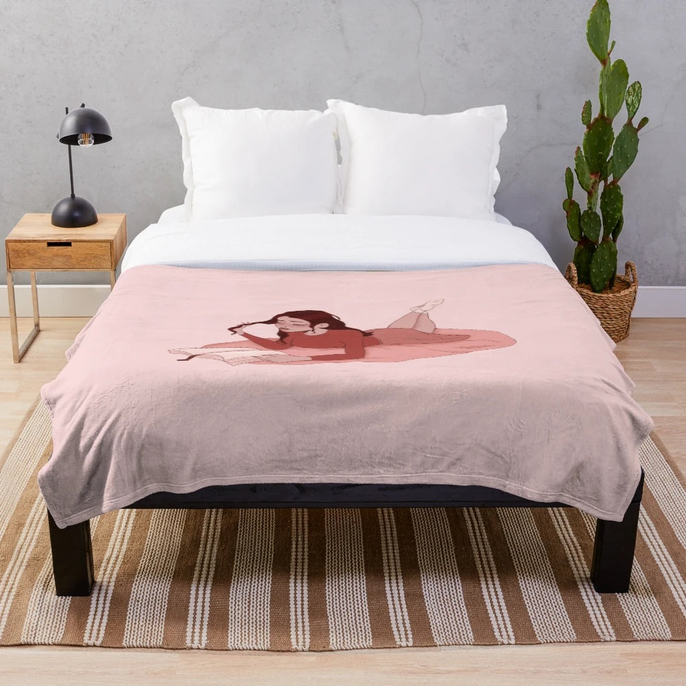 Cute pink plush blanket featuring a bookworm girl design