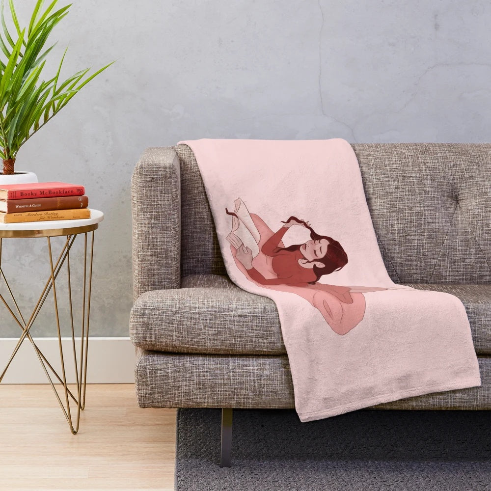 Cute pink plush blanket featuring a bookworm girl design
