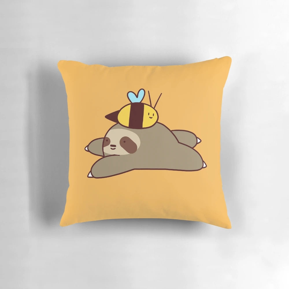 Adorable cartoon sloth and bumble bee printed on a soft, plush pillow