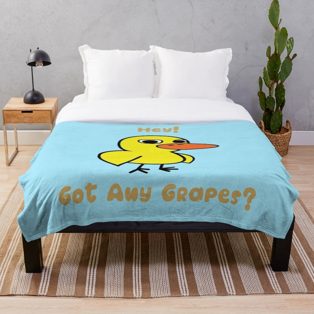 Yellow duck plush blanket with "Hey! Got Any Grapes?" inspired design
