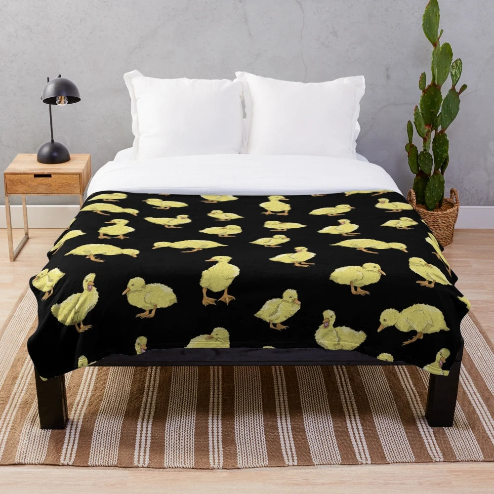 Soft and cozy plush throw blanket featuring an adorable yellow duckling pattern