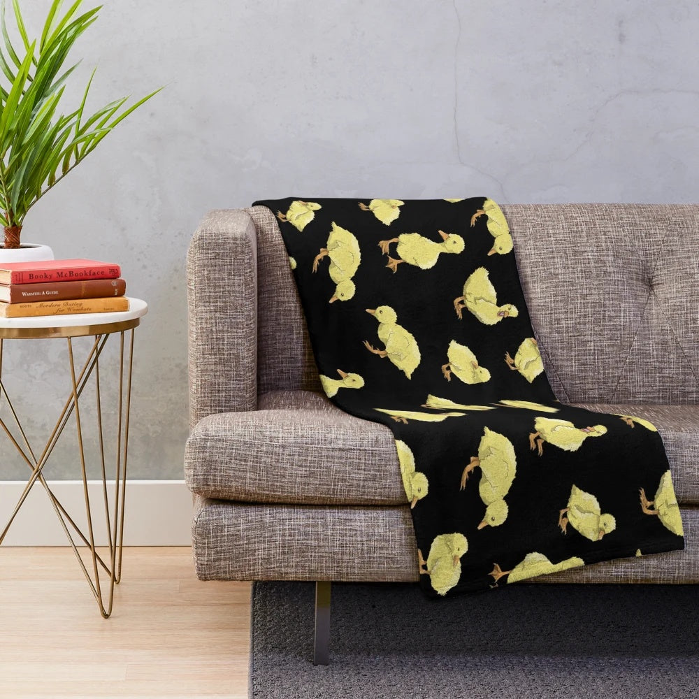 Soft and cozy plush throw blanket featuring an adorable yellow duckling pattern