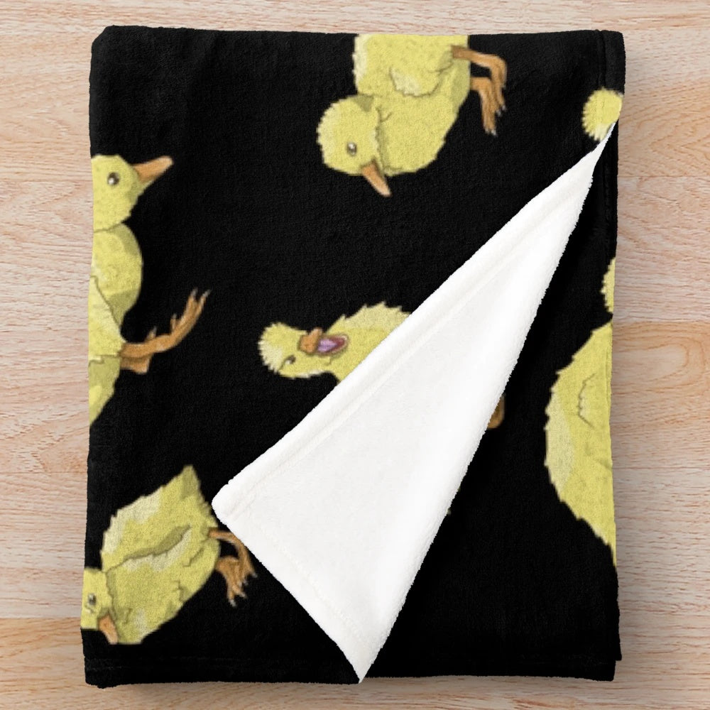 Soft and cozy plush throw blanket featuring an adorable yellow duckling pattern