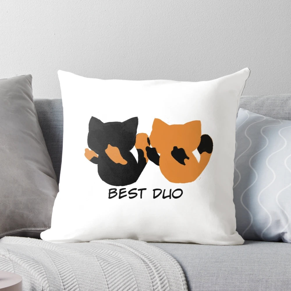 Two adorable kittens snuggling on a soft, plush pillow