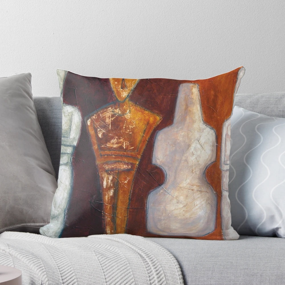 A white throw pillow with a simple design of Cycladic idols, representing ancient Greek art and culture.