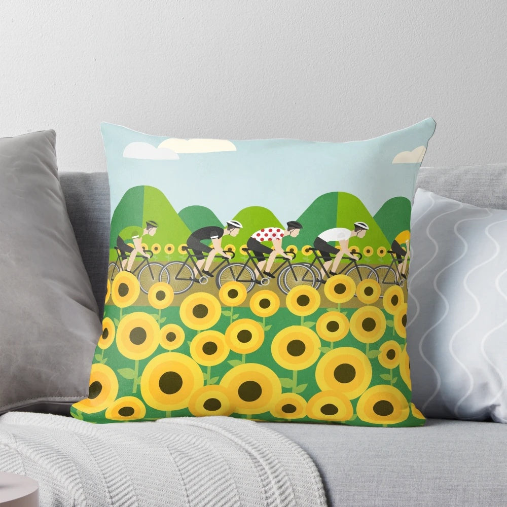 Colorful cycling-themed pillow with bicycle, mountain, and sunflower motifs