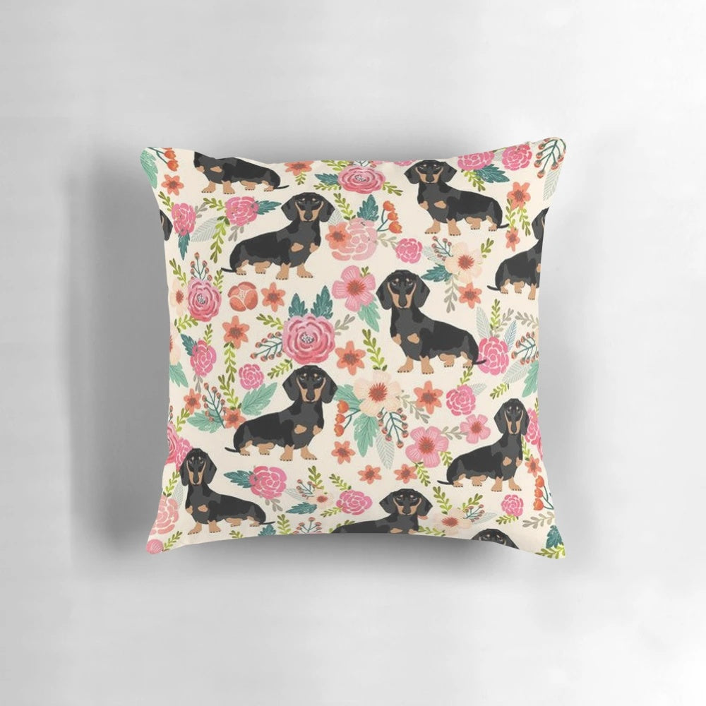 Dachshund dog surrounded by colorful flowers on a decorative pillow
