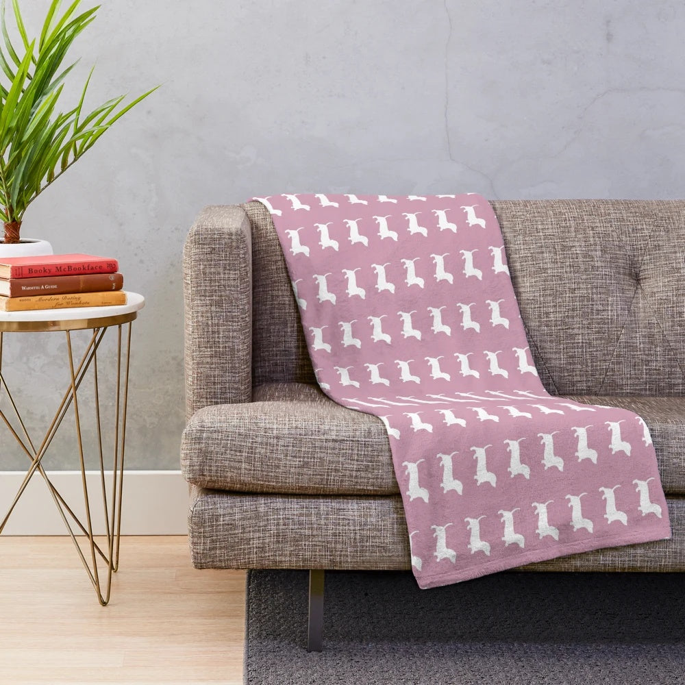 Dusty pink plush blanket with dachshund silhouette design