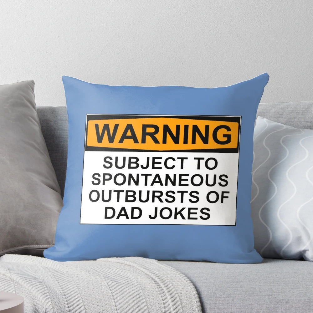 Funny dad joke pillow with the text "WARNING: SUBJECT TO SPONTANEOUS OUTBURSTS OF DAD JOKES