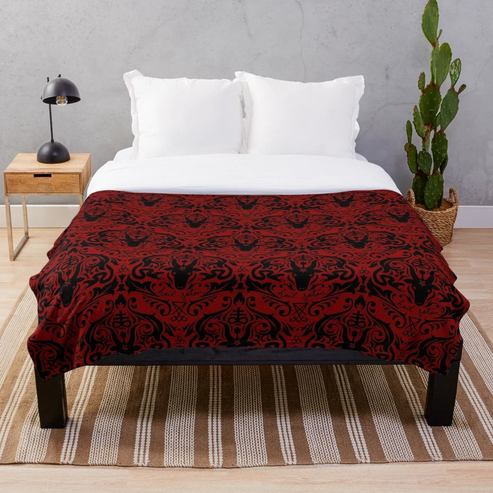 Damask plush blanket with a repeating pattern featuring baphomet, skulls, and other satanic imagery