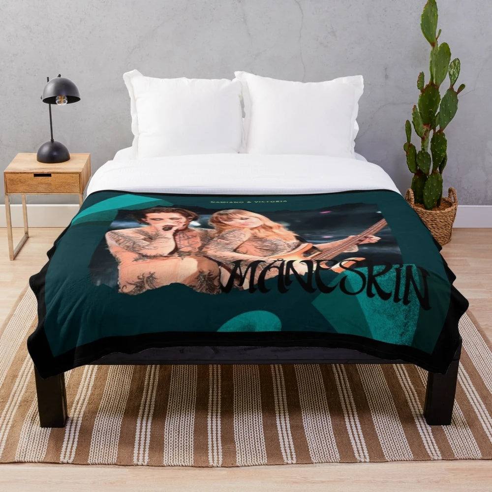 Damiano David of the Italian rock band Maneskin on a plush blanket