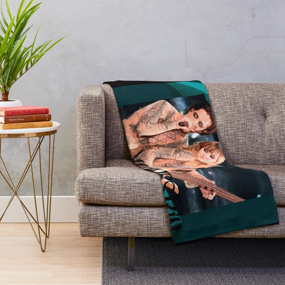 Damiano David of the Italian rock band Maneskin on a plush blanket