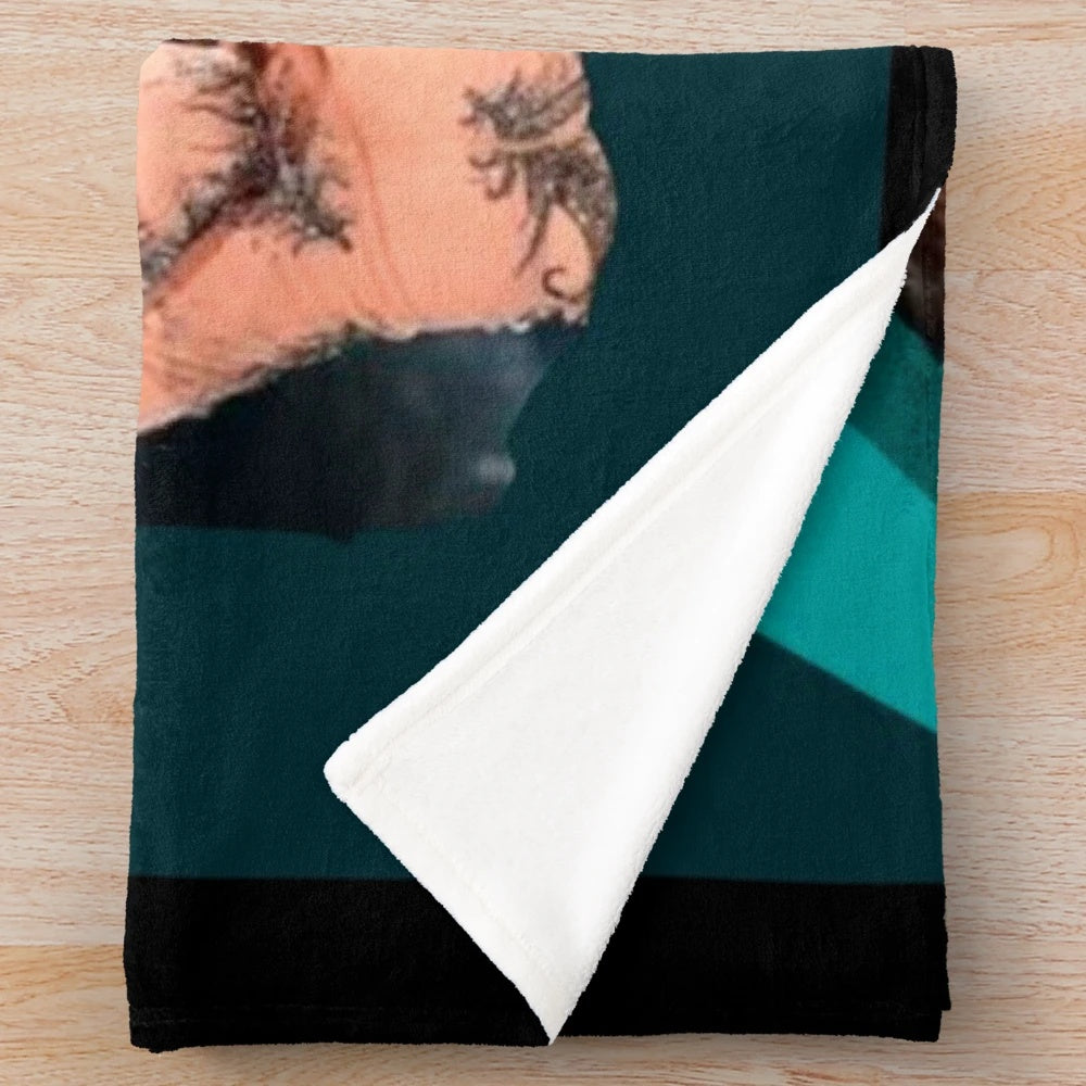 Damiano David of the Italian rock band Maneskin on a plush blanket