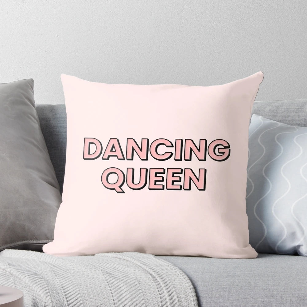 A stylish pink pillow featuring a bold "Dancing Queen" text in black block letters, perfect for ABBA and music lovers.
