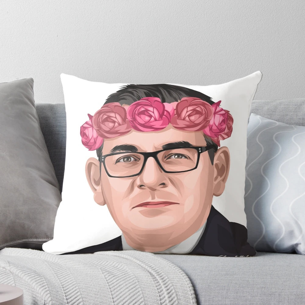 A decorative pillow featuring a flower crown design and the image of Daniel Andrews, the Premier of Victoria, Australia.