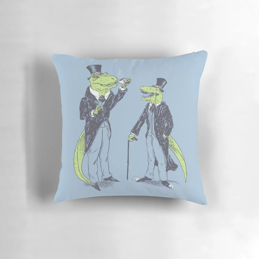 Plush pillows featuring a T-Rex and Velociraptor wearing suits, monocles, and holding tea canes.