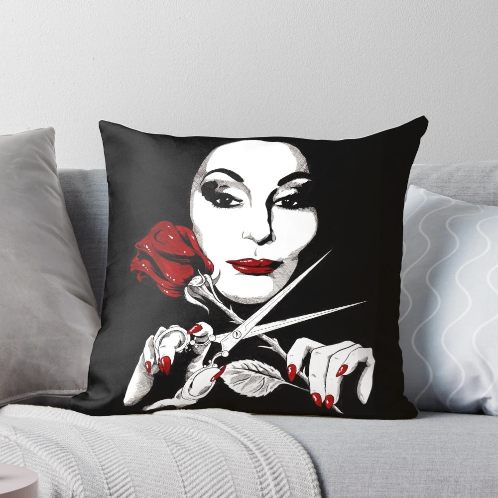 A dark and dreamy throw pillow with an Addams Family-inspired gothic aesthetic, featuring a rose and scissors design.