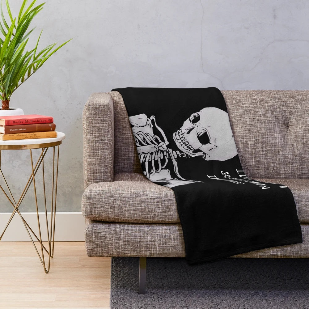 Dark and edgy plush blanket featuring a skeleton design with the text "I'm Only Human