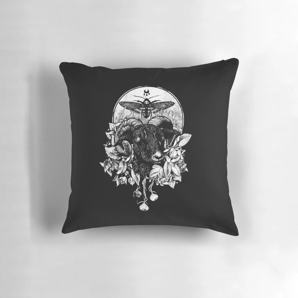 A dark, gothic-style pillow with occult and metal-inspired designs