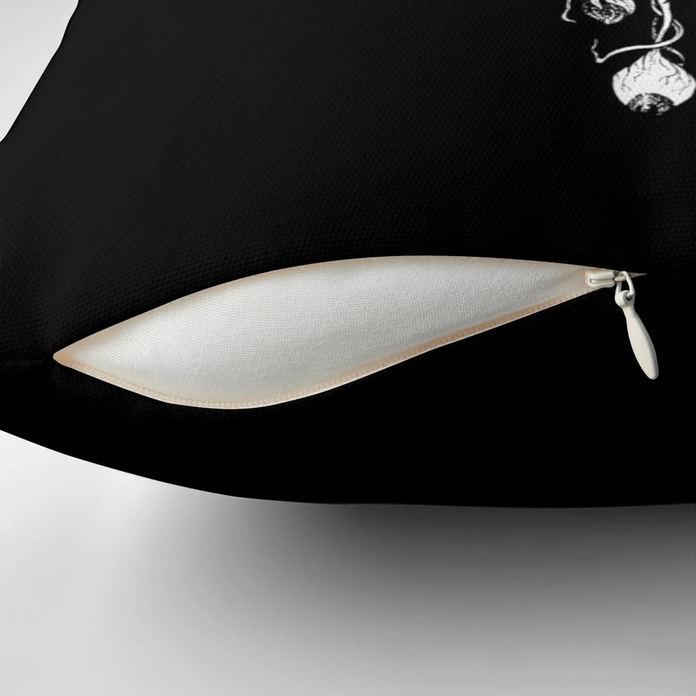 A dark, gothic-style pillow with occult and metal-inspired designs