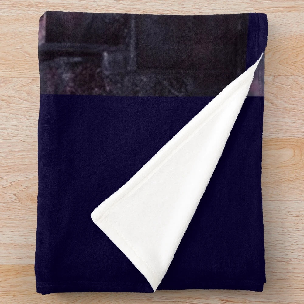 Goth-inspired plush blanket with dark design