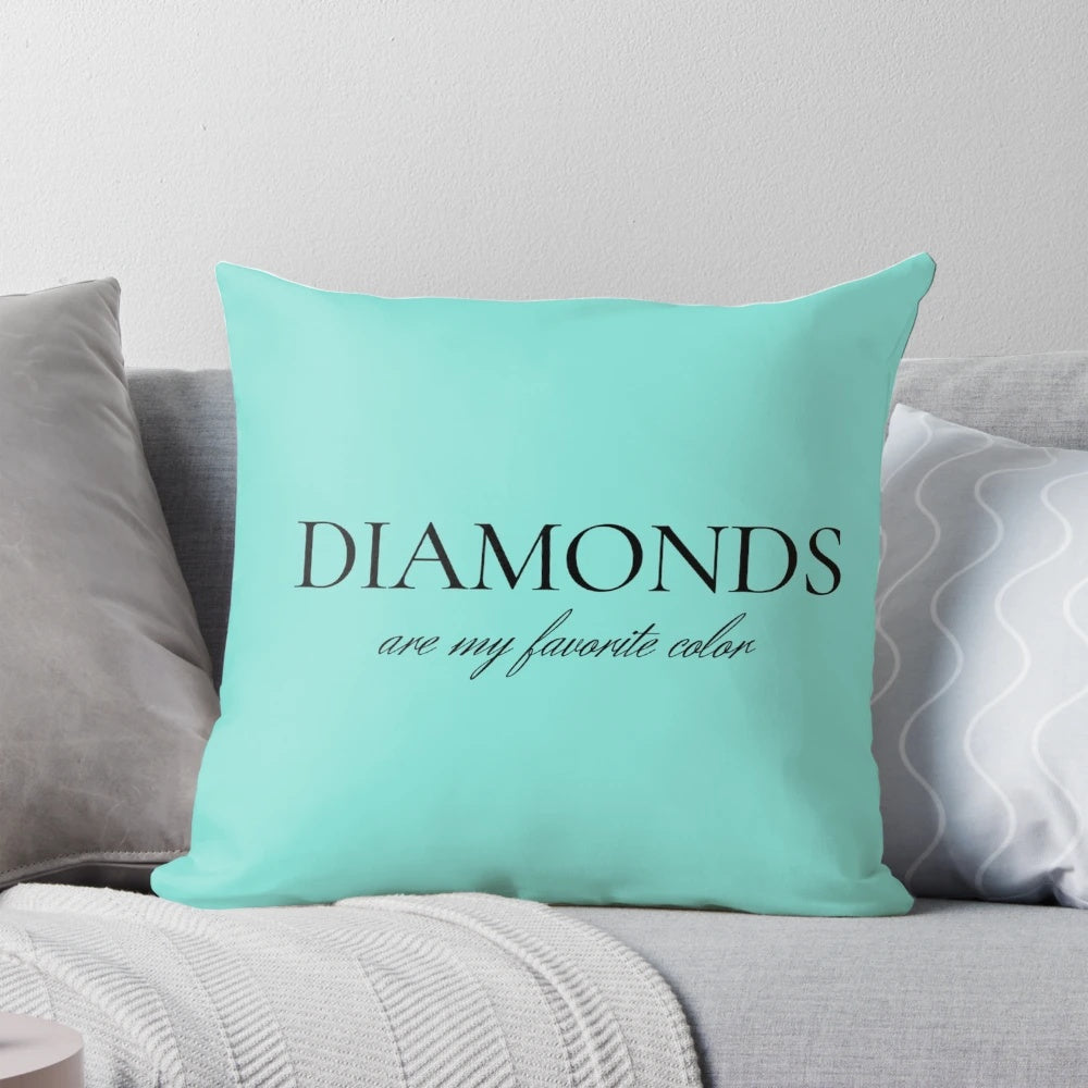 Decorative throw pillow with a diamond-inspired design in shades of blue and white.