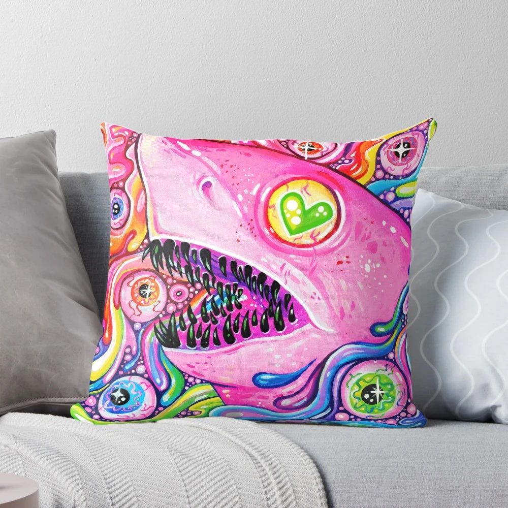 Vibrant pillow featuring a glitter-filled shark with mesmerizing eyes and teeth against a rainbow background