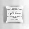 Black and white 'All Art is Quite Useless' decorative pillow featuring a classic quote from Oscar Wilde's 'The Picture of Dorian Gray