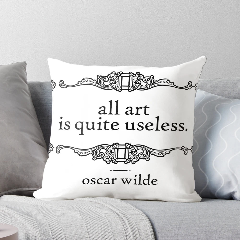 Black and white 'All Art is Quite Useless' decorative pillow featuring a classic quote from Oscar Wilde's 'The Picture of Dorian Gray