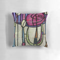 A colorful throw pillow featuring the iconic floral design of Charles Rennie Mackintosh, a renowned Scottish architect and designer of the Art Nouveau movement.