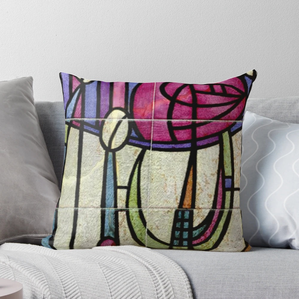 A colorful throw pillow featuring the iconic floral design of Charles Rennie Mackintosh, a renowned Scottish architect and designer of the Art Nouveau movement.