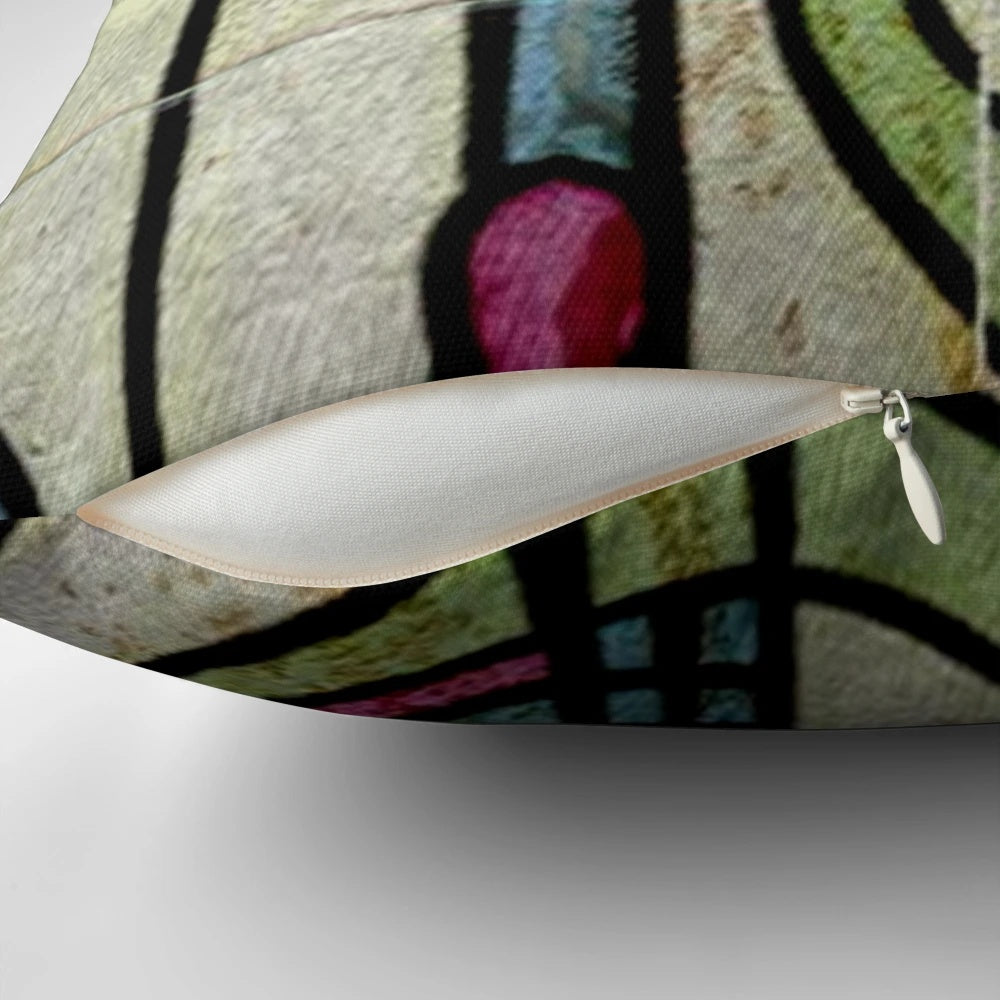 A colorful throw pillow featuring the iconic floral design of Charles Rennie Mackintosh, a renowned Scottish architect and designer of the Art Nouveau movement.