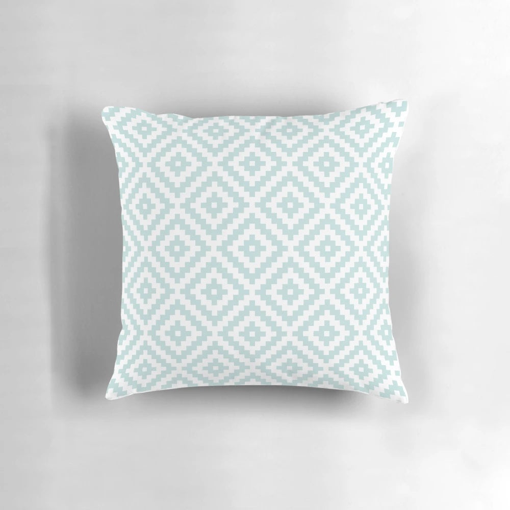 Decorative throw pillow featuring an abstract Aztec-inspired pattern in shades of duck egg blue and white.