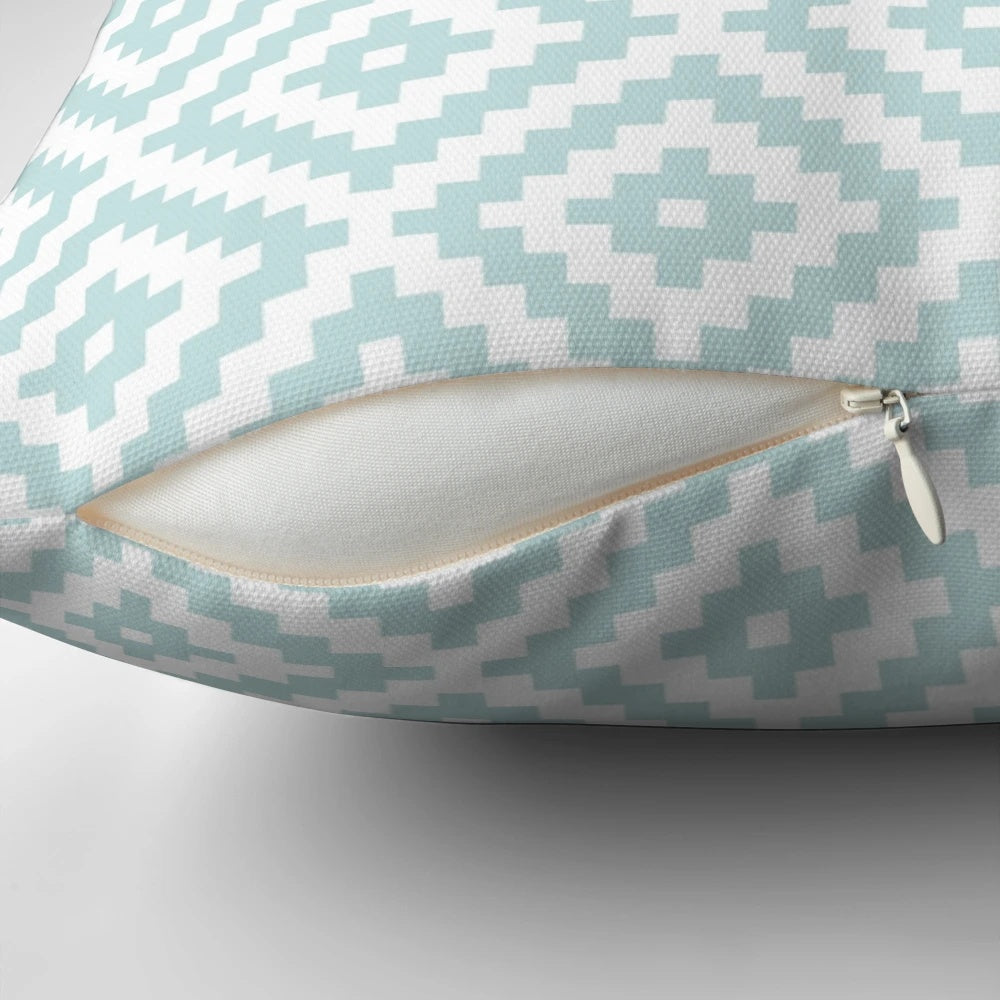Decorative throw pillow featuring an abstract Aztec-inspired pattern in shades of duck egg blue and white.