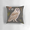 Decorative throw pillow featuring a hand-painted watercolor illustration of a grey barn owl perched on a botanical branch with blackberries.