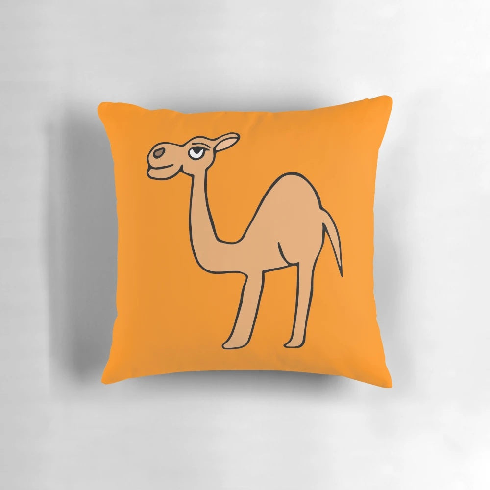An orange-colored decorative throw pillow featuring a camel design by Everything Eli.