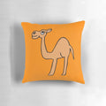 An orange-colored decorative throw pillow featuring a camel design by Everything Eli.