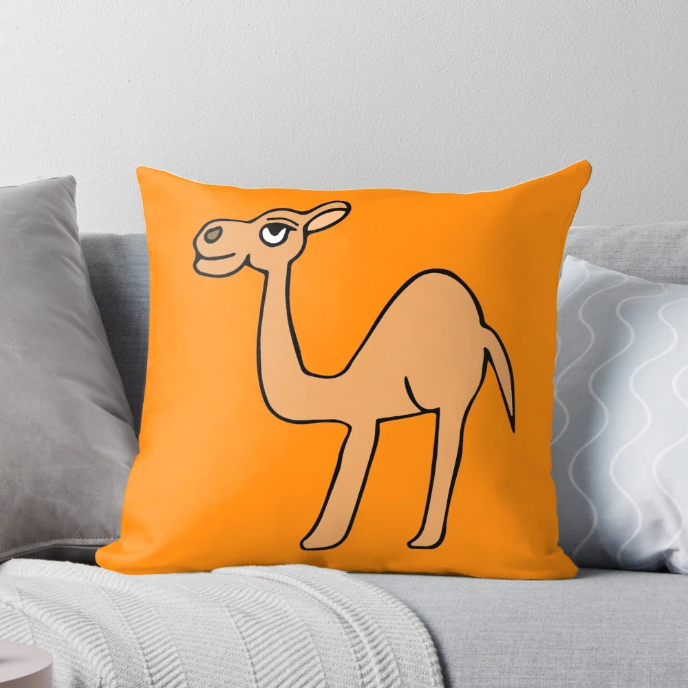 An orange-colored decorative throw pillow featuring a camel design by Everything Eli.