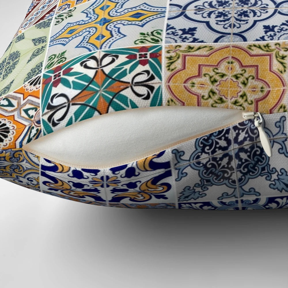 Pillow featuring a collage of colorful, abstract ceramic tile patterns inspired by traditional Portuguese azulejo design.