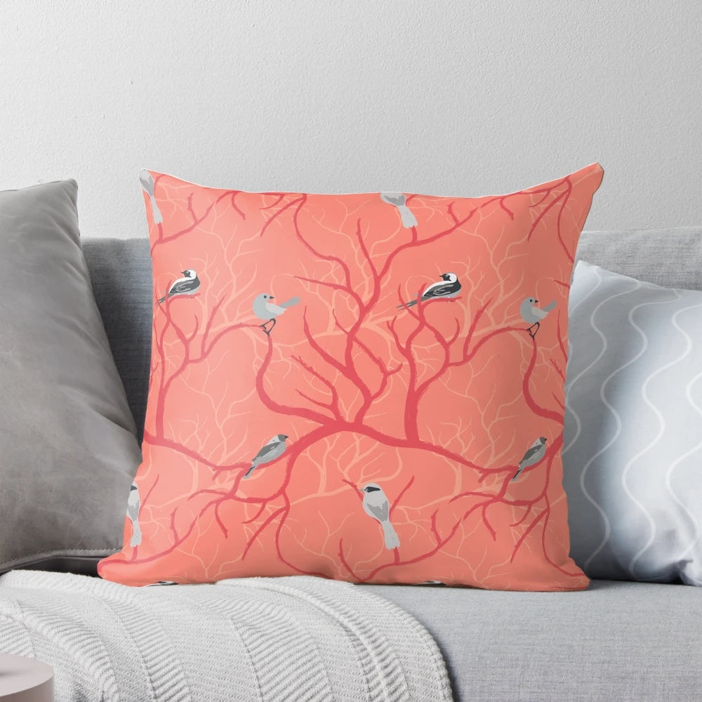Decorative coral pillow with a beautiful birds design, perfect for adding a touch of nature-inspired style to any bedroom.