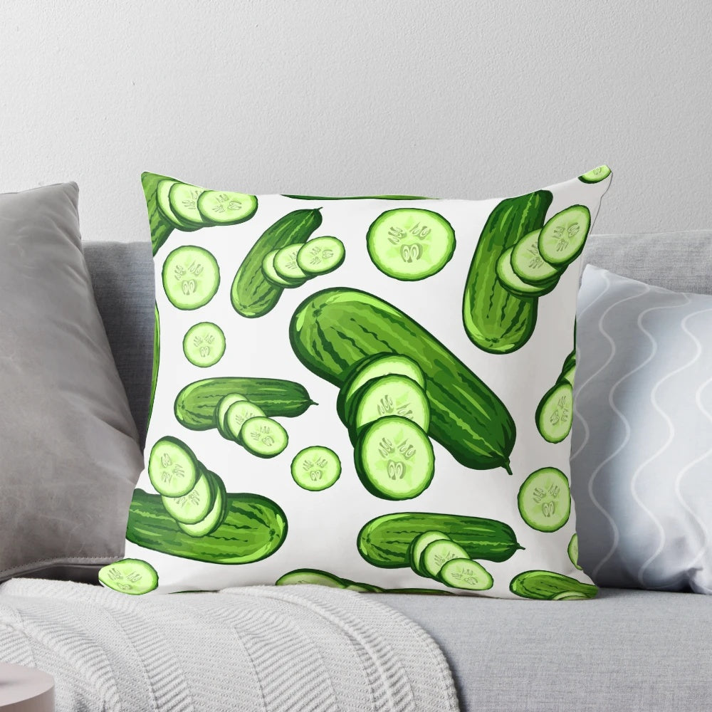Close-up image of a decorative pillow featuring a vibrant, abstract cucumber pattern in various shades of green.