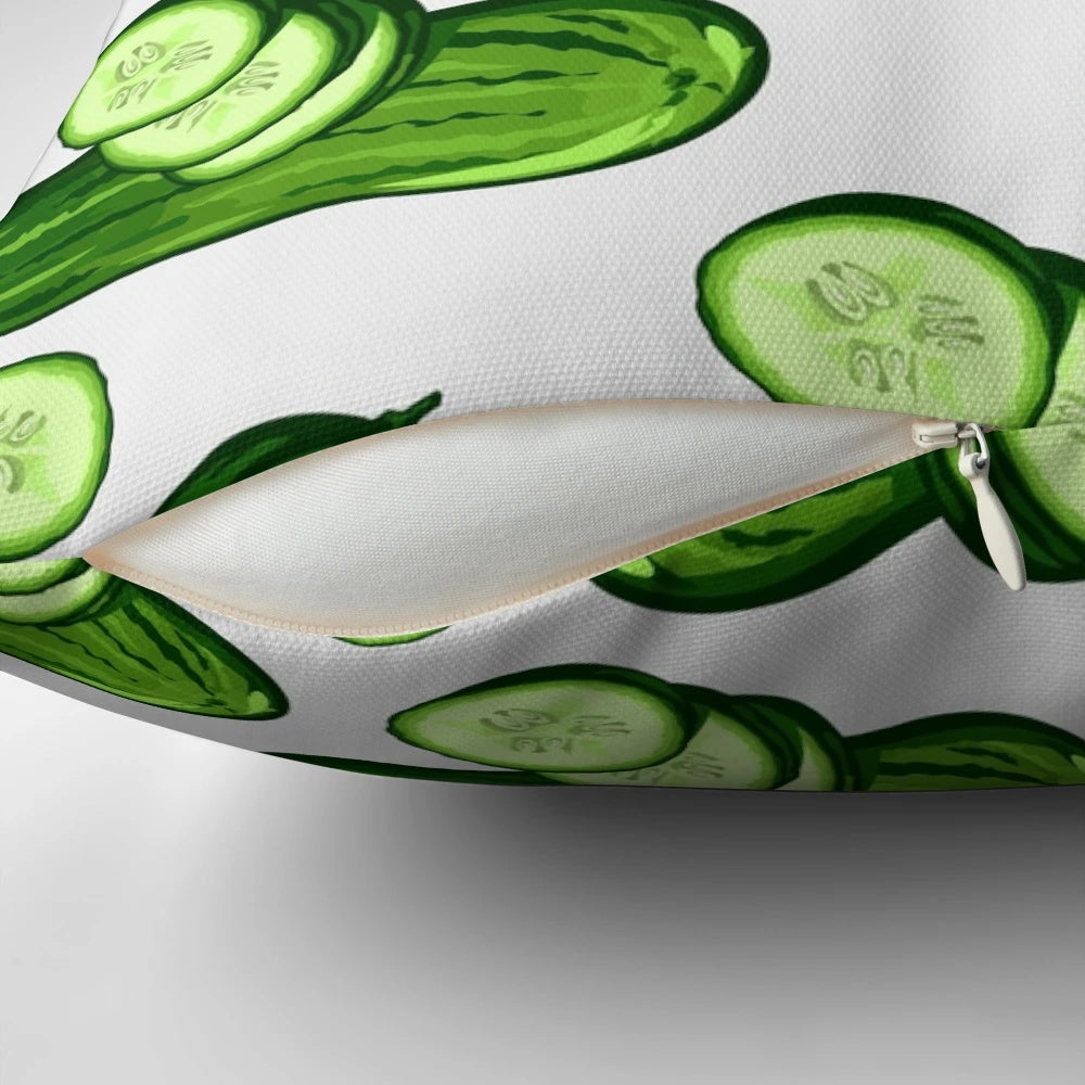 Close-up image of a decorative pillow featuring a vibrant, abstract cucumber pattern in various shades of green.