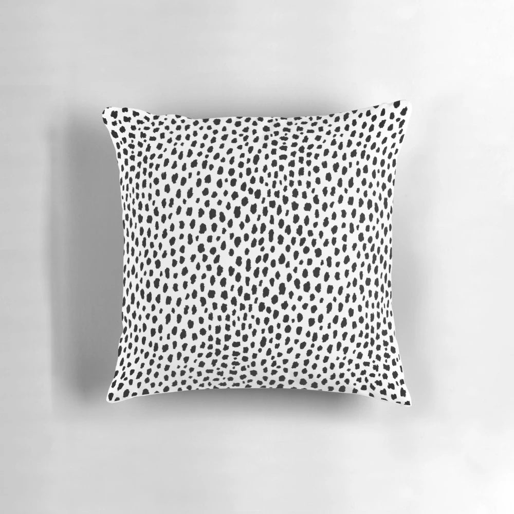 Decorative dalmatian spots patterned throw pillow in black and white