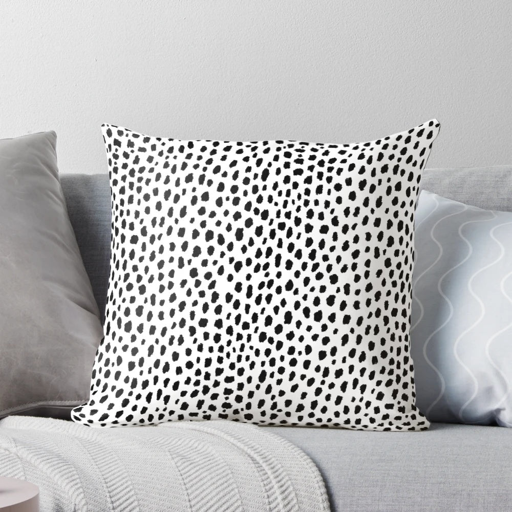 Decorative dalmatian spots patterned throw pillow in black and white
