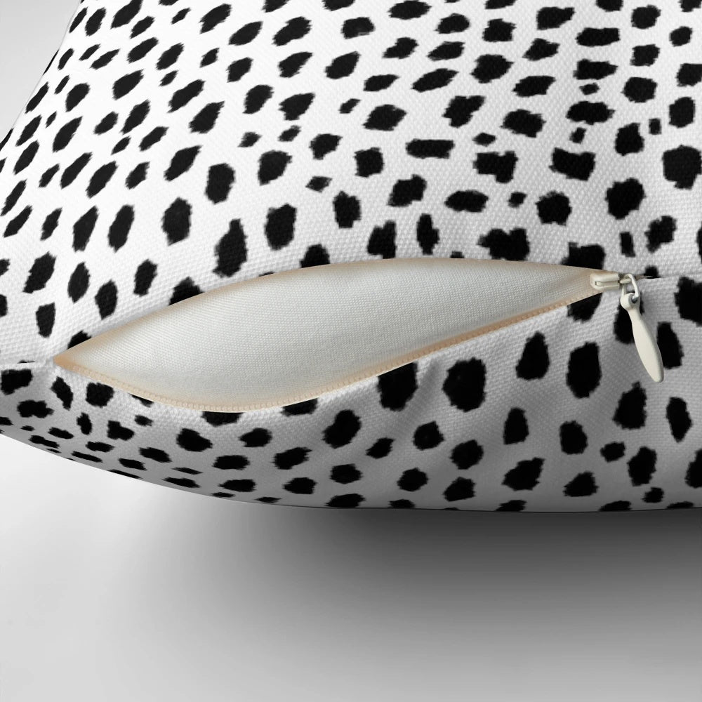 Decorative dalmatian spots patterned throw pillow in black and white