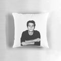 A stylish pillow featuring the image of Dylan O'Brien, the popular actor from Teen Wolf.