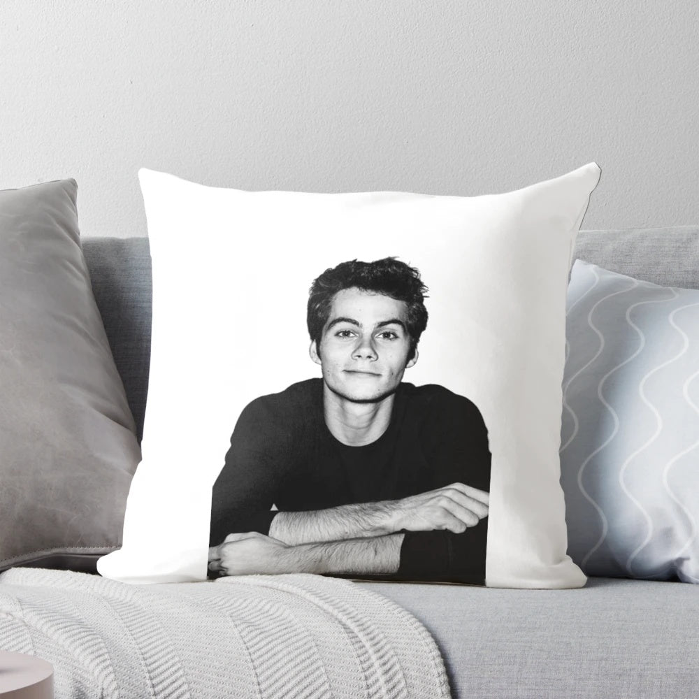 A stylish pillow featuring the image of Dylan O'Brien, the popular actor from Teen Wolf.